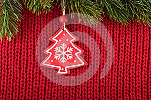 Christmas tree decoration on red wool background in a farmhouse style