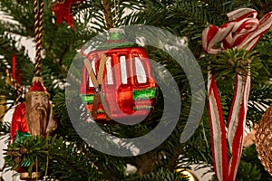 Christmas tree decoration in the shape of a red ski gondola with fixed skis