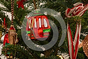 Christmas tree decoration in the shape of a red ski gondola with fixed skis photo