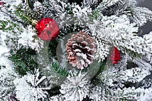 Christmas tree decoration with toys and cone close up