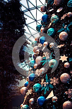 Christmas tree decoration in vintage blue orange turquoise toned colors as vertical Christmas holidays background