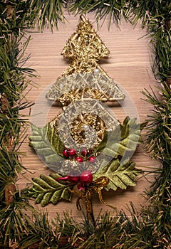 Christmas tree decoration with wreath frame wooden background