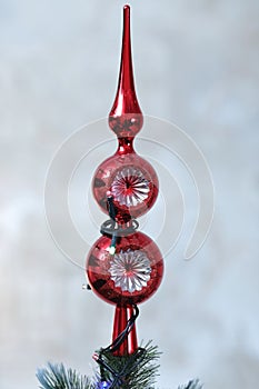 Christmas tree decorations - balls, hearts, tinsel, garland, hanging on a Christmas tree