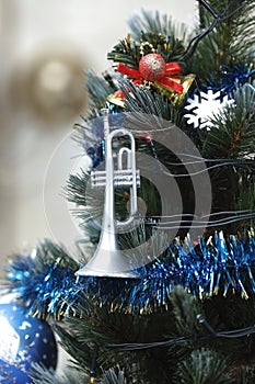 Christmas tree decorations - balls, hearts, tinsel, garland, hanging on a Christmas tree