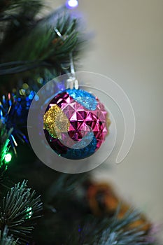 Christmas tree decorations - balls, hearts, tinsel, garland, hanging on a Christmas tree