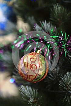 Christmas tree decorations - balls, hearts, tinsel, garland, hanging on a Christmas tree