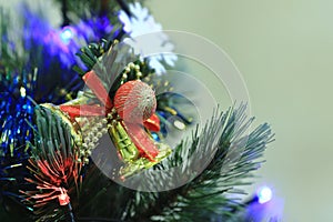 Christmas tree decorations - balls, hearts, tinsel, garland, hanging on a Christmas tree