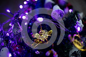 Christmas tree decorations in blue lights background