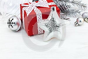 Christmas tree decorations with fir branch, jingle bell and gift