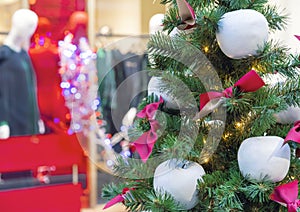 Christmas tree with decorations in the form of white apples