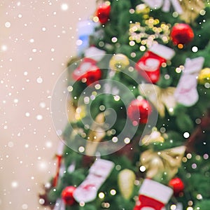 Christmas tree with decorations and lights, blurred abstract holiday background