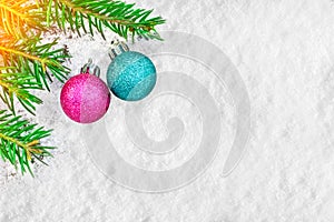 Christmas tree and decorations on the snow surface. Picturesque winter composition.