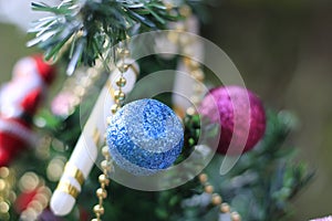 Christmas tree with decorations on a special background blur