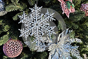 Christmas tree decorations and toys for fir trees covered with snow and ice. Close-up. Happy New Year and Merry Christmas.