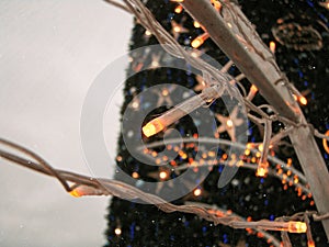 Christmas tree is decoreted with garland