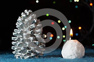 Christmas tree decotations cone and candle photo