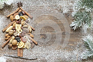 Christmas tree with dried fruits and nuts abstract background