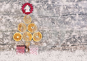 Christmas Tree From Dried Oranges, Cinnamon Sticks And Red Star.