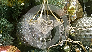 Christmas tree festive decorations. Glass shiny droplets. Gold and silver decor. Traditional Xmas ornaments. Happy New Year. Winte