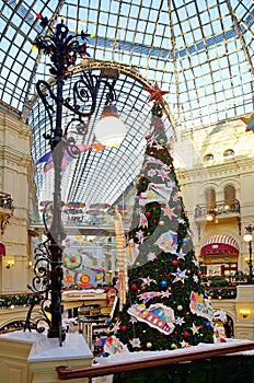 Christmas tree in the festive interior of Gum, Moscow, Russia