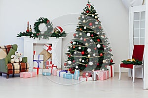 Christmas tree with fireplace interior of white room new year decoration garland gifts