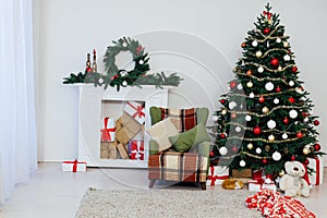 Christmas tree with fireplace interior of white room new year decoration garland gifts