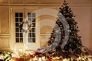Christmas tree garland lights with New Year`s Eve gifts