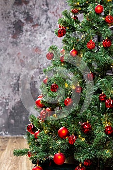 Christmas tree with garlands and red balls in the living room, beautiful new year background