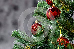 Christmas tree with garlands and red balls in the living room, beautiful new year background