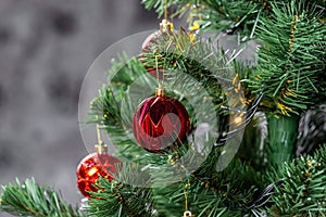 Christmas tree with garlands and red balls in the living room, beautiful new year background