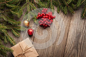 Christmas tree with gift box and decorations on wooden backgroun