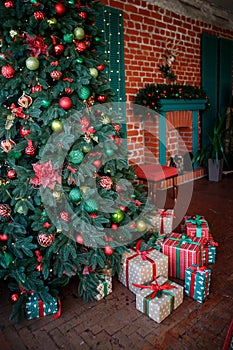 Christmas tree with gift close up.