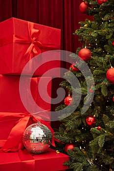 Christmas tree and gifts on a background. Red color box