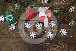 christmas tree with gifts and decorations snowflakes on the wooden background. Christmas and New Year concept. Flat lay Top view W