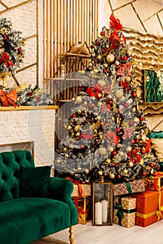 Christmas tree with gifts and green sofa in the living room