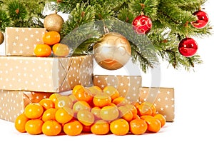 Christmas tree with gifts and presents and mandarines