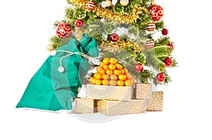 Christmas tree with gifts and presents and mandarines