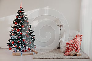 Christmas tree with Christmas gifts in White Hall on Christmas