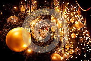 Christmas tree with gold ball and bokeh lights background. Xmas