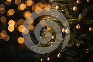 a christmas tree with gold ornaments in front of a blurred background