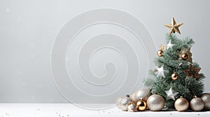 Christmas tree with golden and silver decorations on a white background. Copy space