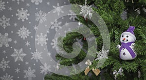 Christmas tree on a gray background with snowflakes