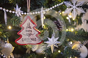 Christmas tree and hanging decoration with Merry Christmas text