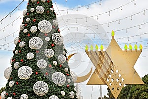 Christmas tree, Hanukkah menorah and crescent in Haifa, Israel