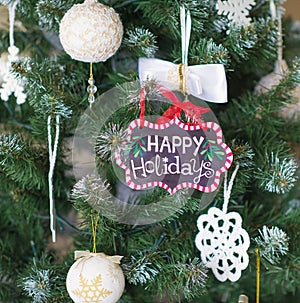 Christmas tree with Happy holidays sign