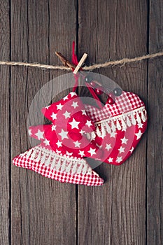 Christmas tree and heart toy on wooden background