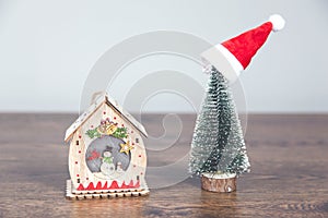 Christmas tree and house model on desk