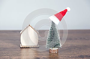 Christmas tree and house model on desk