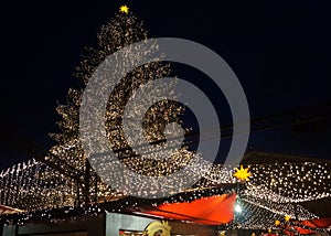 Christmas Tree Lights up Christmas Market at Night