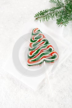 Christmas tree lolly on a festive Christmas snow